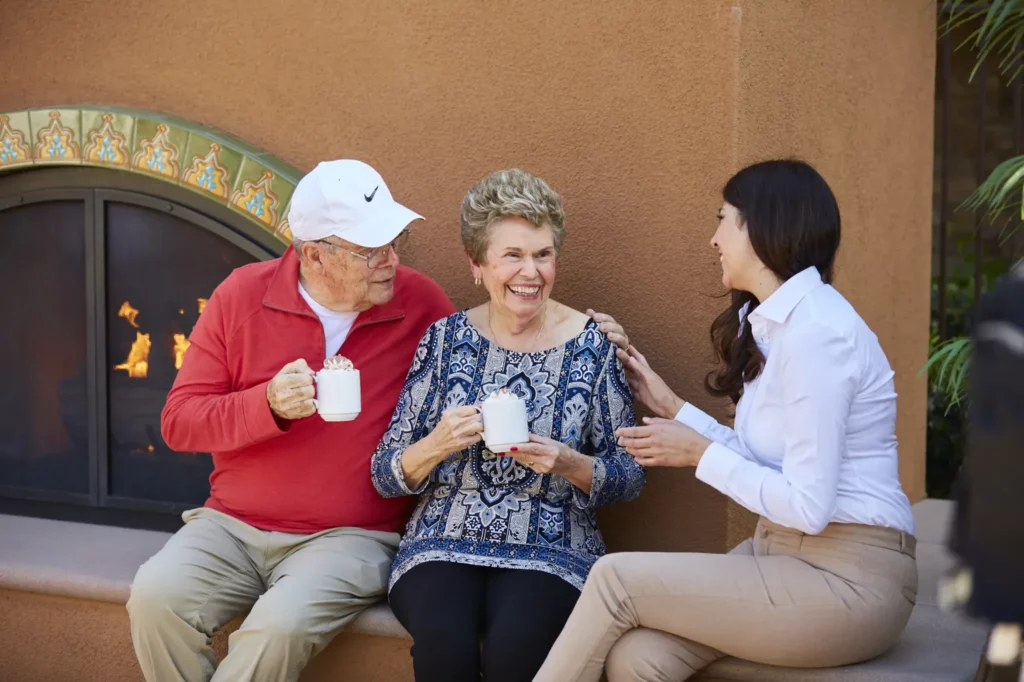 valencia-terrace-Lifestyle-residents-socializing-by-outdoor-fireplace
